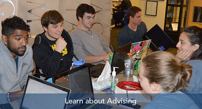 Students discussing advising
