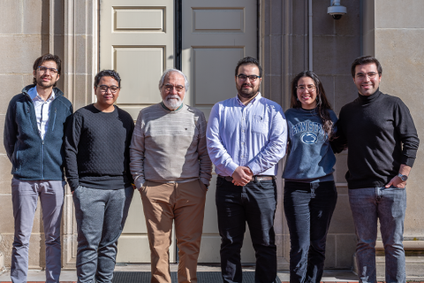 Nicolas Bueno, Nijat Gasimli, Ianna Gomez, Hanif Yoga, Baran Yucel, and Turgay Ertekin standing in front of Hosler building